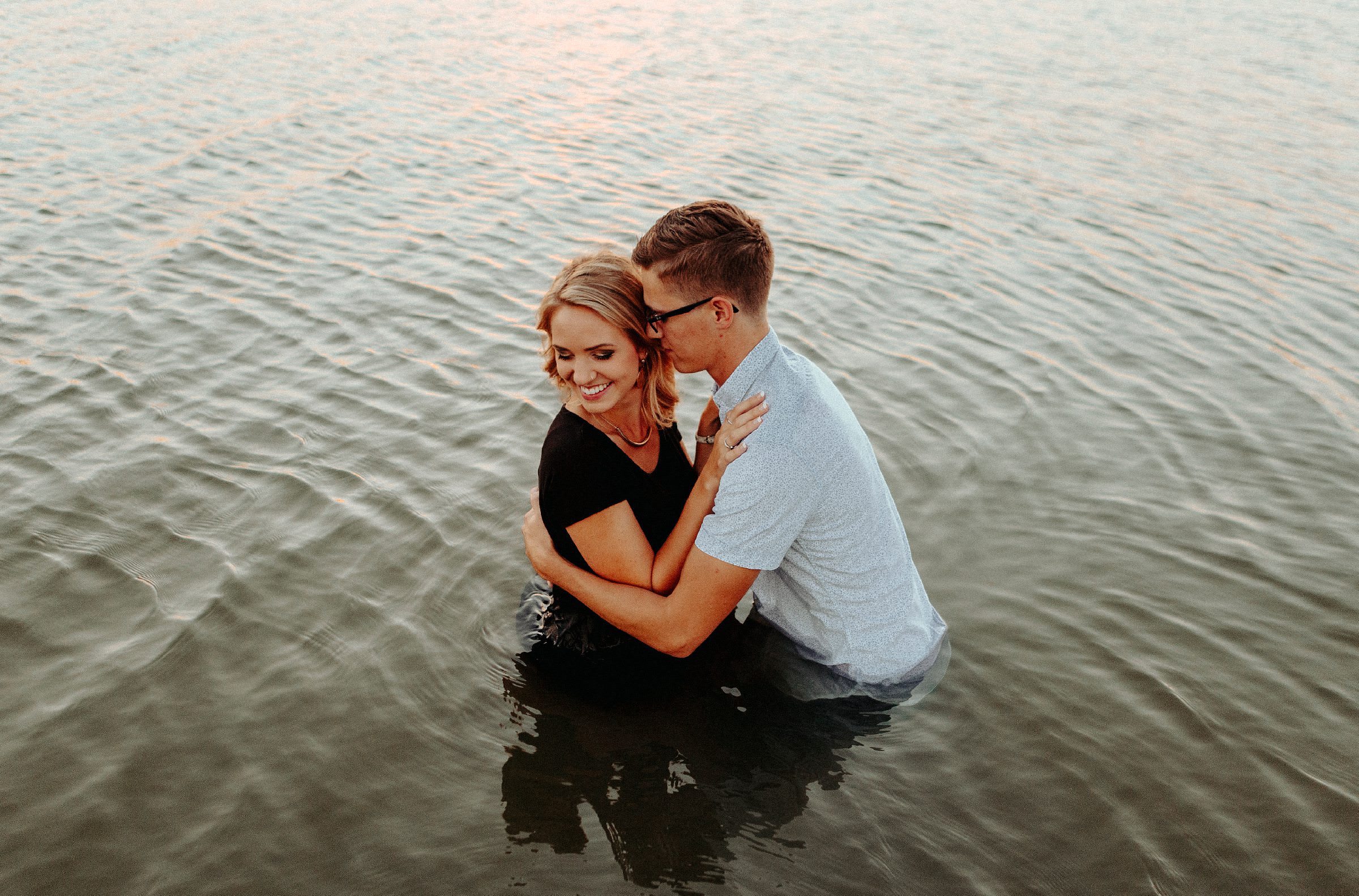 A couple in the water during their engagement session in California